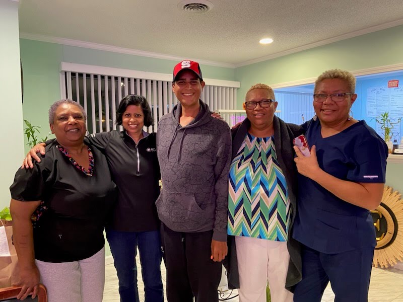 Brian with his family and the team from Ella's celebrating one year of his health transformation
